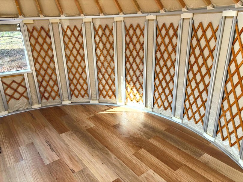 Interior of a 4.5m Yurt showing the bamboo lattice